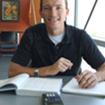 male student with notebook and calculator